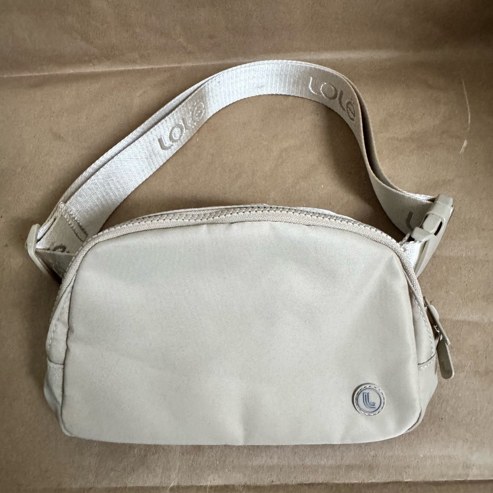Lole Beige Unisex Adjustable Belt/Crossbody Bag. 19cm x 12.70cm x 5cm